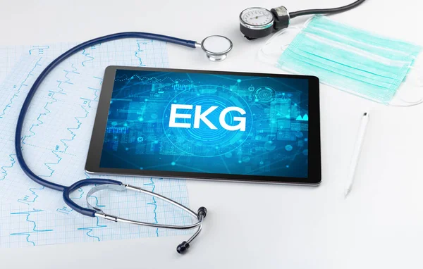 stock image Close-up view of a tablet pc with EKG abbreviation, medical concept