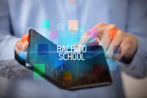 Young Man Holding Foldable Smartphone Back School Inscription Educational Concept — ストック写真