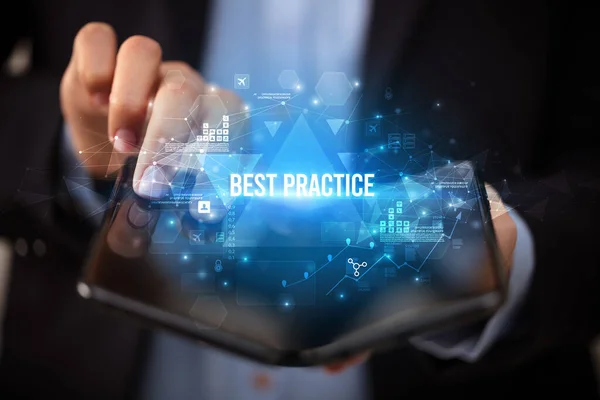Businessman Holding Foldable Smartphone Best Practice Inscription Business Concept — 스톡 사진