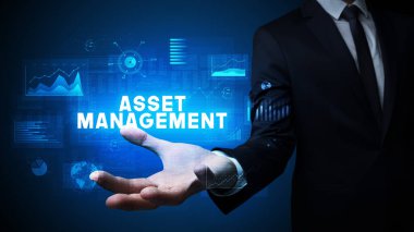 İş adamının elinde ASSET MANAGEMENT yazıtları, iş başarısı konsepti