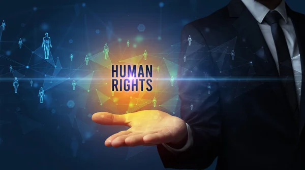 Elegant hand holding HUMAN RIGHTS inscription, social networking concept
