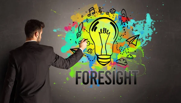Businessman Drawing Colorful Light Bulb Foresight Inscription Textured Concrete Wall — Stock Photo, Image