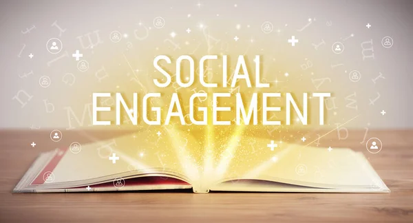 Open book with SOCIAL ENGAGEMENT inscription, social media concept