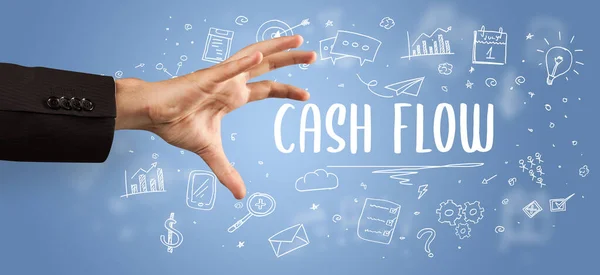 Close-Up of cropped hand pointing at CASH FLOW inscription, modern business solution concept