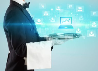 Genç garson tepside dizüstü bilgisayar simgeleri sunuyor, yeni iş modeli konsepti