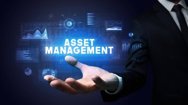 İş adamının elinde ASSET MANAGEMENT yazıtları, iş başarısı konsepti