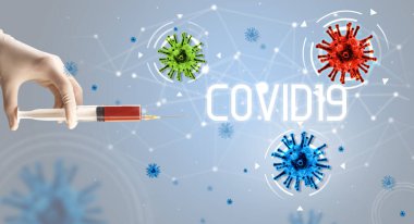 Şırınga, elinde COVID19 yazısıyla tıbbi enjeksiyon, koronavirüs aşısı konsepti