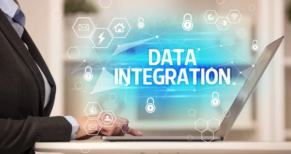 DATA INTEGRATION inscription on laptop, internet security and data protection concept, blockchain and cybersecurity