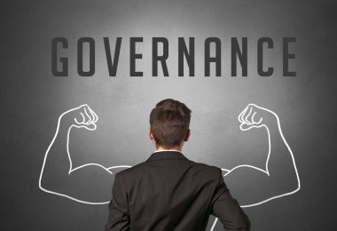 GOVERNANCE yazıtları, güçlü iş konsepti olan bir işadamının arka görünümü