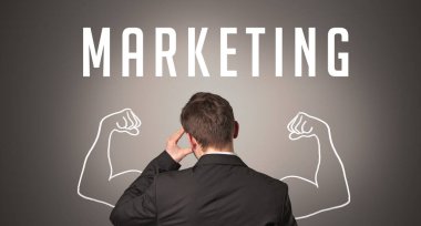 MARKETING yazıtları, güçlü iş konsepti olan bir işadamının arka görünümü