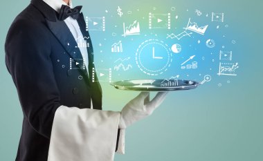 Smokinli yakışıklı garson, elinde zaman tepsisiyle tepside ikonlar, küresel piyasa konsepti.