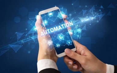 AUTOMATION yazıtlı akıllı telefon, modern teknoloji konsepti
