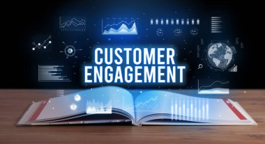 Açık bir kitaptan çıkan Müşteri Katılımı yazıt, yaratıcı iş konsepti