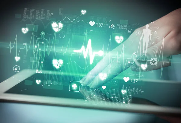 stock image Close-up of a touchscreen with ECG icons, modern healthcare concept