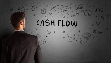 CASH FLOW yazıtları ve iş stratejisi konseptiyle yaratıcı bir fikir çizimi yapan işadamı.