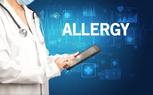 stock image young doctor writing down notes with ALLERGY inscription, healthcare concept