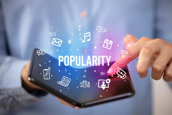 Zakenman Met Een Opvouwbare Smartphone Met Popularity Inscriptie Social Media — Stockfoto