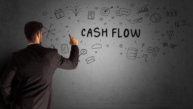 CASH FLOW yazıtları ve iş stratejisi konseptiyle yaratıcı bir fikir çizimi yapan işadamı.