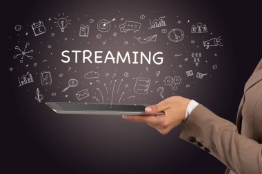 STREAMING yazıtlı, sosyal medya kavramlı bir dokunmatik ekran yakın plan