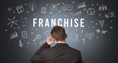 FRANCHISE yazıtları, modern iş konsepti olan bir işadamının arka görüşü