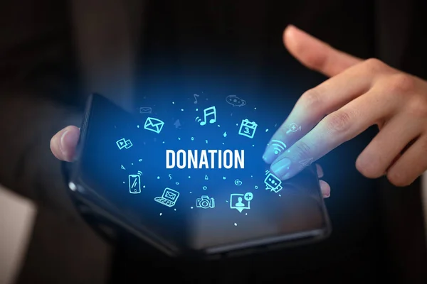 Biznesmen Składanym Smartfonem Napisem Donation Koncepcja Social Media — Zdjęcie stockowe