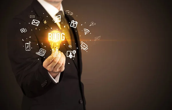 Businessman Holding Light Bulb Blog Inscription Social Media Concept — Stock Photo, Image