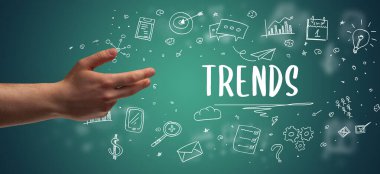 TRENDS yazıtı, modern iş çözümleri kavramına işaret eden kırpılmış ellerin yakın çekimi