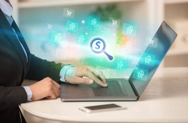 Businessman Working Laptop Magnifying Glass Dollar Sign Icons Coming Out — Stock Photo, Image