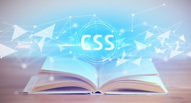 CSS kısaltmalı açık kitap, modern teknoloji kavramı