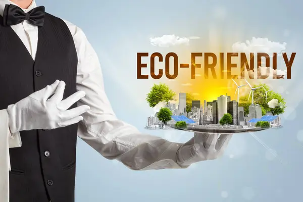 Waiter serving eco city with ECO-FRIENDLY inscription, renewabke energy concept