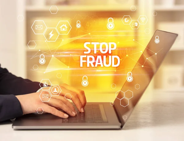STOP FRAUD inscription on laptop, internet security and data protection concept, blockchain and cybersecurity