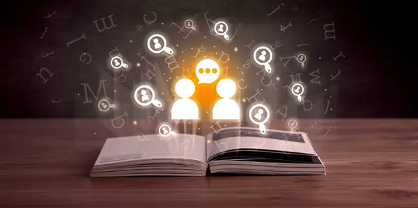 Open book with talking icons above, social networking concept