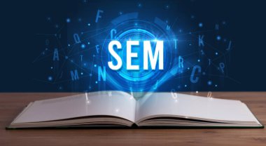 Açık bir kitaptan çıkan Sem yazımı, dijital teknoloji konsepti