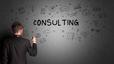 businessman drawing a creative idea sketch with CONSULTING inscription, business strategy concept