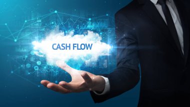 Cash Flow yazıtlarını tutan iş adamının eli, başarılı iş konsepti