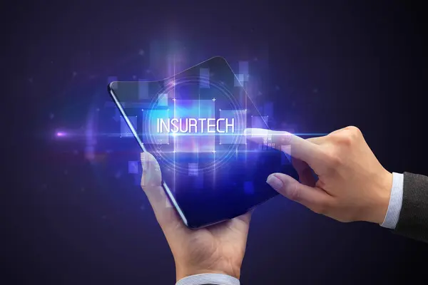 Empresario Sosteniendo Smartphone Plegable Con Inscripción Insurtech Concepto Nueva Tecnología — Foto de Stock