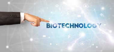 BIOTECHNOLOGY yazıtlarına el işareti, modern teknoloji kavramı