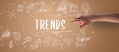 TRENDS yazıtı, modern iş çözümleri kavramına işaret eden kırpılmış ellerin yakın çekimi