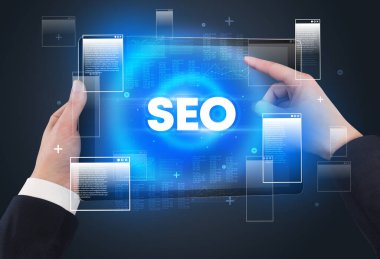 SEO kısaltması, modern teknoloji kavramına sahip bir tabletin yakın çekimi