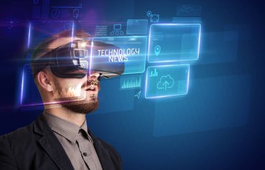 Businessman looking through Virtual Reality glasses with TECHNOLOGY NEWS inscription, new technology concept