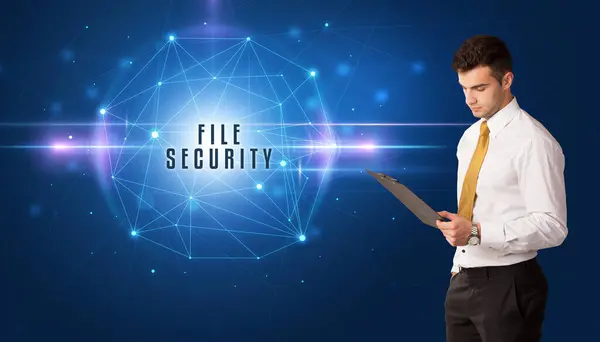 stock image Businessman thinking about security solutions with FILE SECURITY inscription