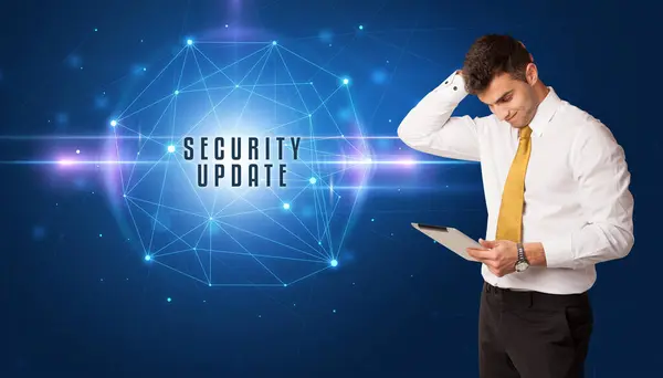 stock image Businessman thinking about security solutions with SECURITY UPDATE inscription