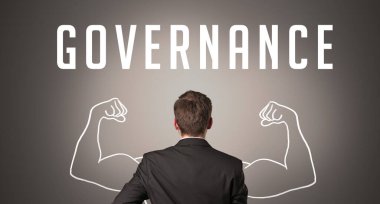 GOVERNANCE yazıtları, güçlü iş konsepti olan bir işadamının arka görünümü