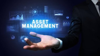 İş adamının elinde ASSET MANAGEMENT yazıtları, iş başarısı konsepti