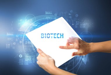 BIOTECH yazıtlı el işi fütüristik tablet, yeni teknoloji kavramı