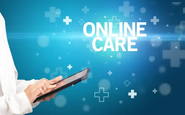 stock image doctor writes notes on the clipboard with ONLINE CARE inscription, first aid concept