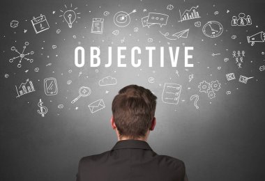 OBJECTIVE yazıtları olan bir iş adamının arka görüşü, modern iş kavramı