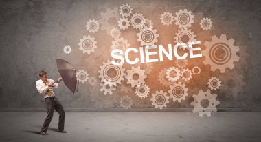 Bilim Yazıtları ve Teknoloji Konsepti 'nden şemsiyeyle savunma yapan iş adamı