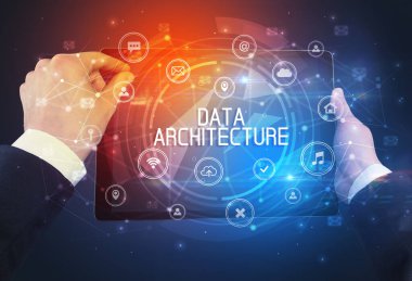 DATA ARCHITECTURE yazıtlı bir tabletin yakın çekimi, yenilikçi teknoloji kavramı