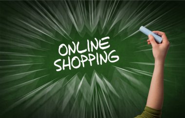 Hand drawing ONLINE SHOPPING inscription with white chalk on blackboard, online shopping concept clipart